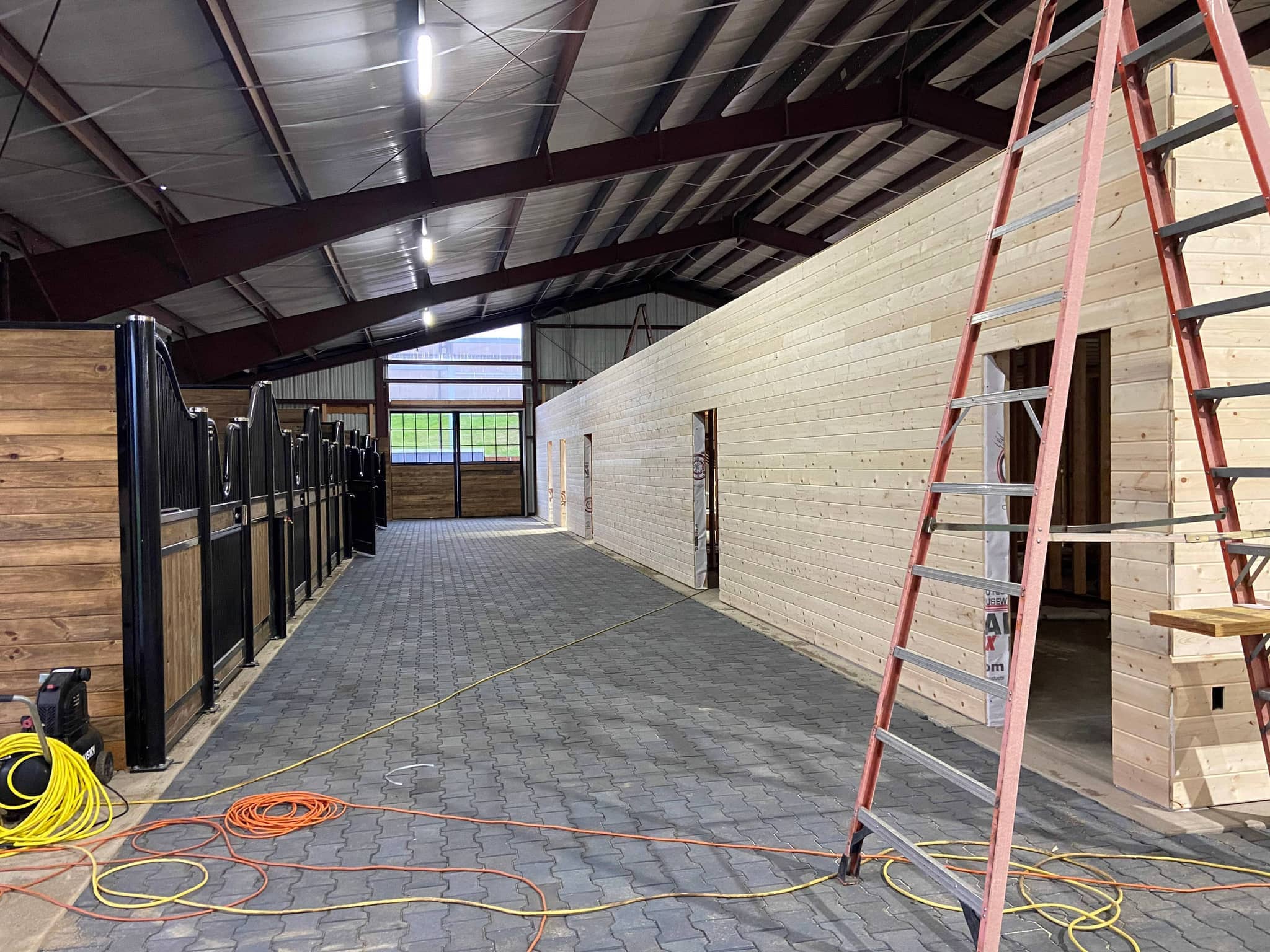 Aerial view of the Hidden Creek barn and paddocks