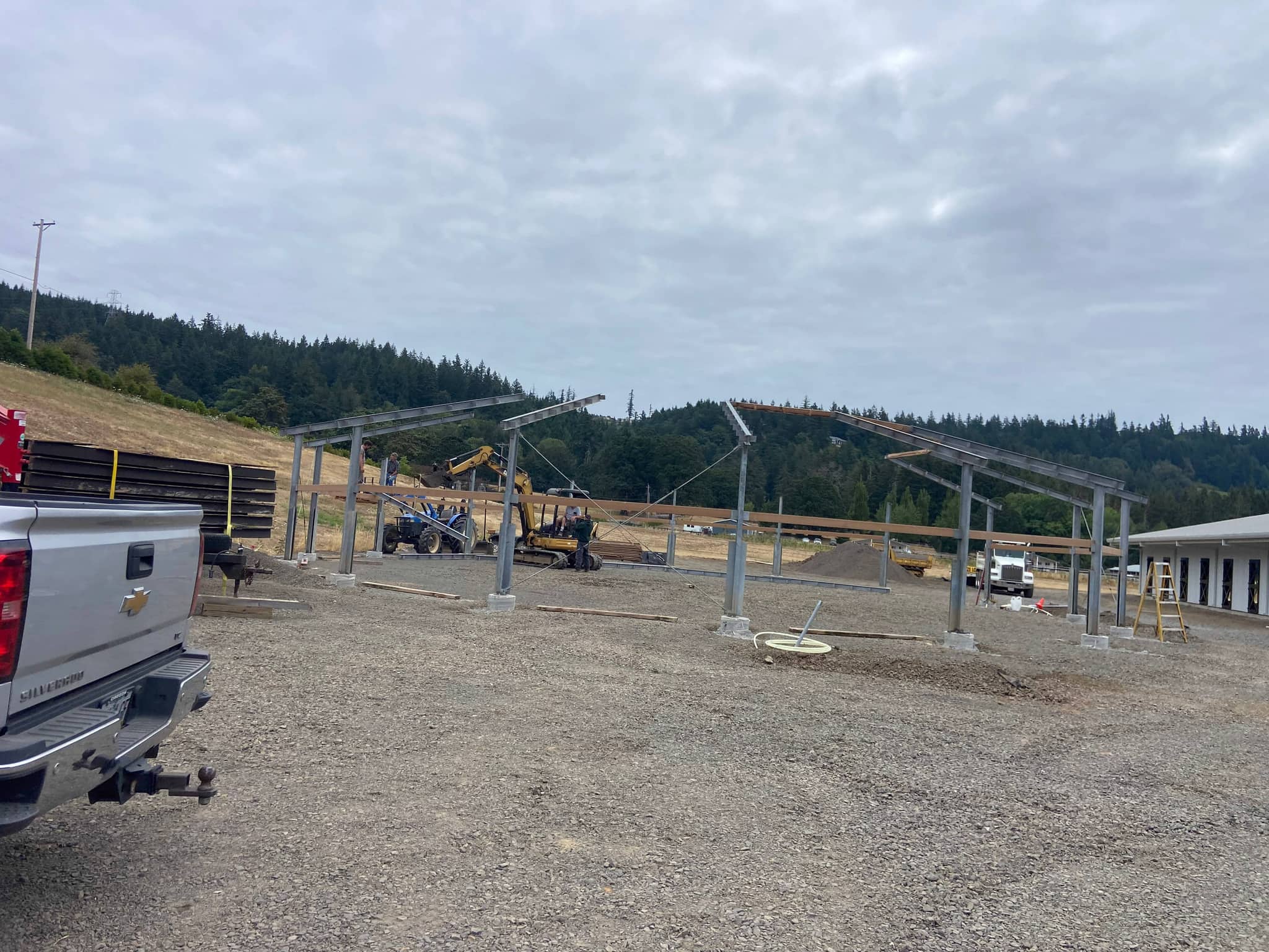 Aerial view of barn, paddocks, and training areas at Hidden Creek